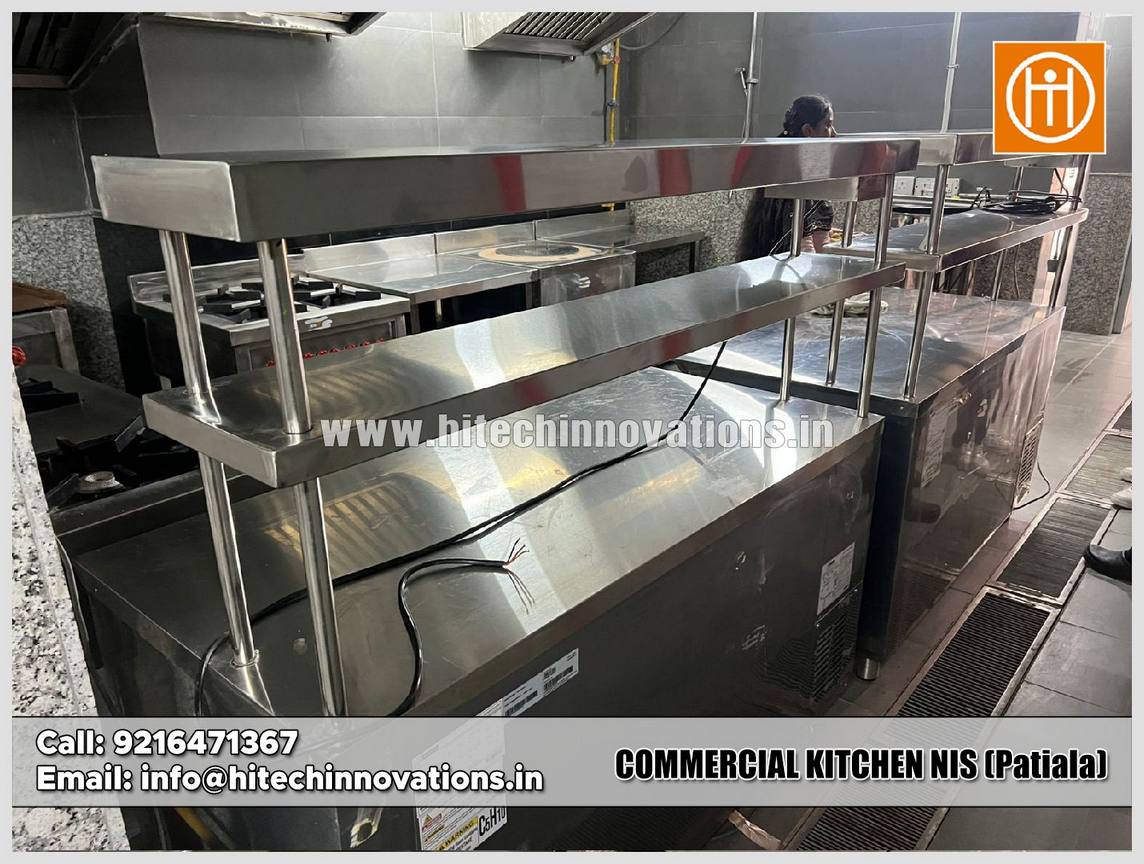 Custom stainless steel commercial griddle and burner unit with under-counter refrigeration installed at NIS Patiala kitchen.