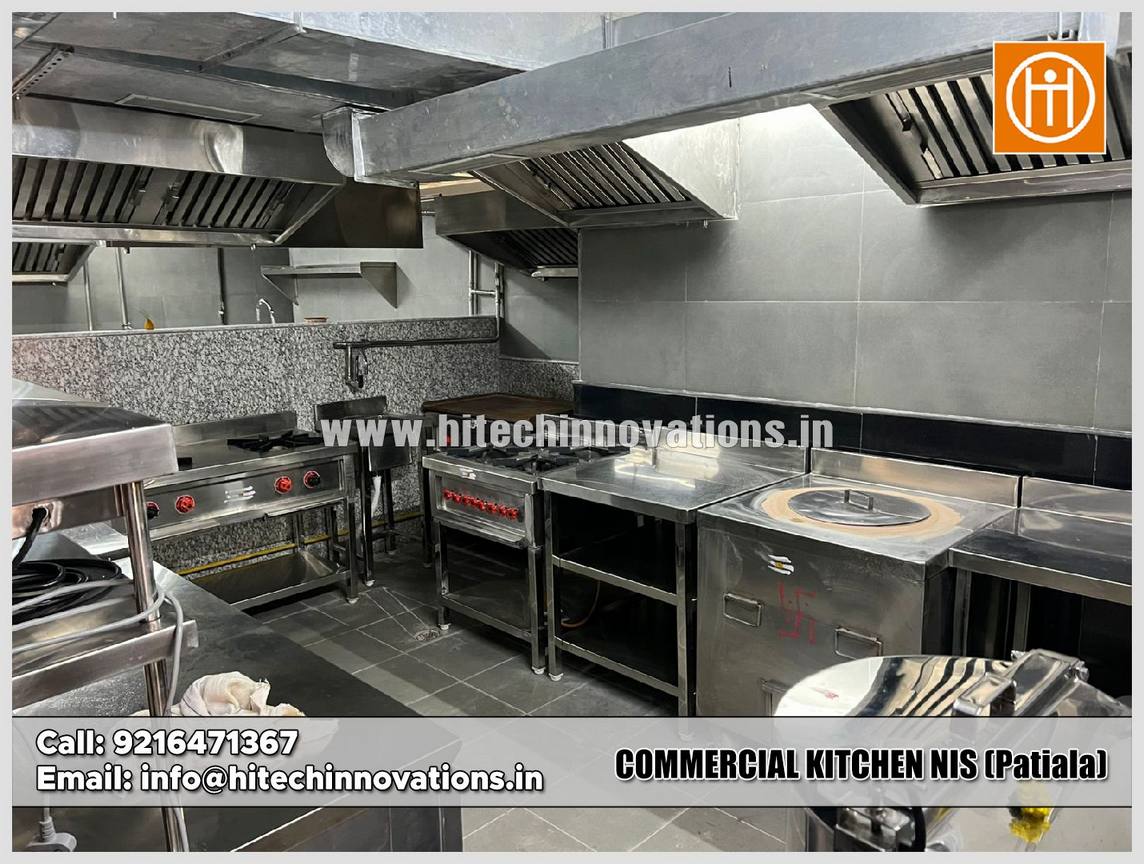 Commercial kitchen cooking line at NIS Patiala featuring a stainless steel tandoor oven, multiple gas burners, and heavy-duty exhaust canopy.