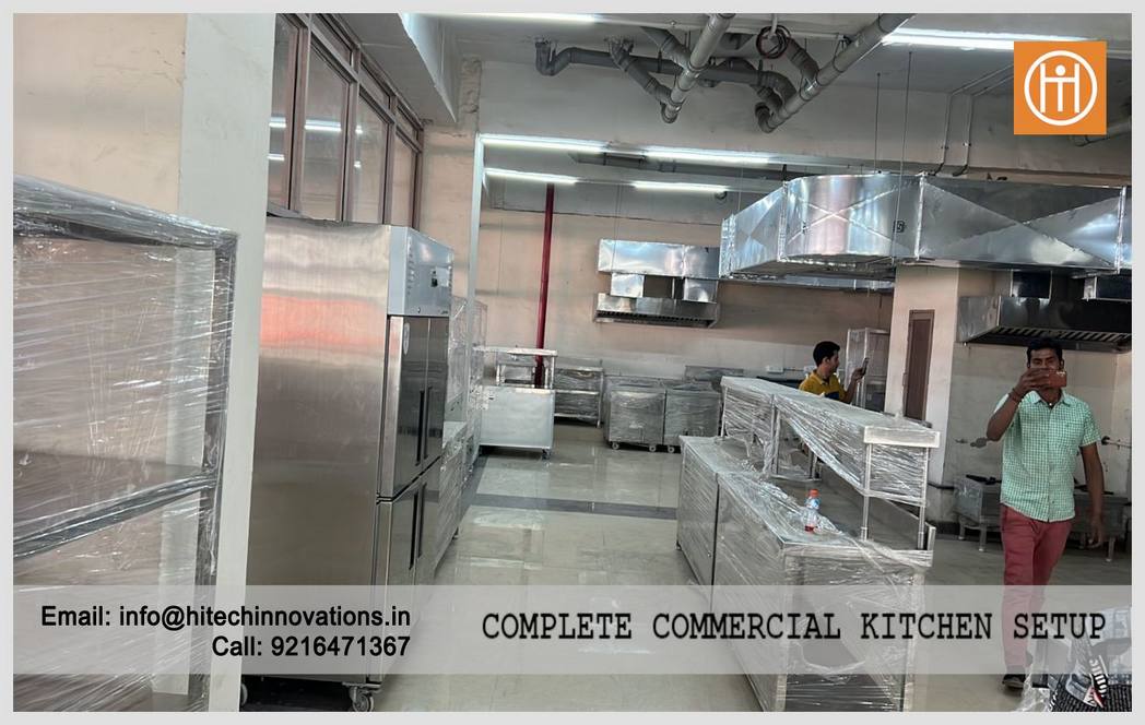 Finished commercial kitchen interior at  PCA Stadium featuring industrial refrigerators and prep stations.