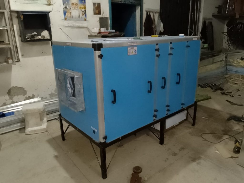 A high-capacity industrial air washer unit under construction at the Hitech Innovations workshop in Mohali, featuring professional blue powder-coated panels.