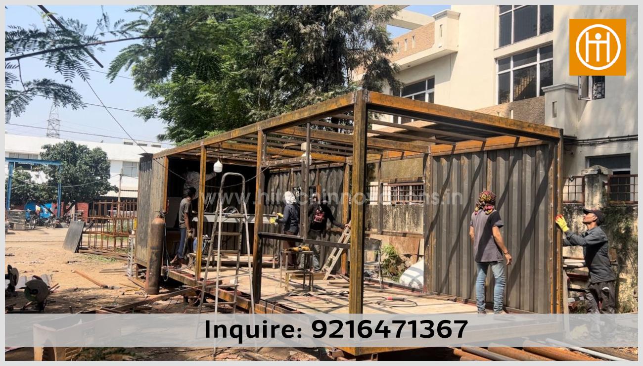 Workers at Hitech Innovations Mohali assembling the heavy-duty steel structural frame for a custom container home or site office.