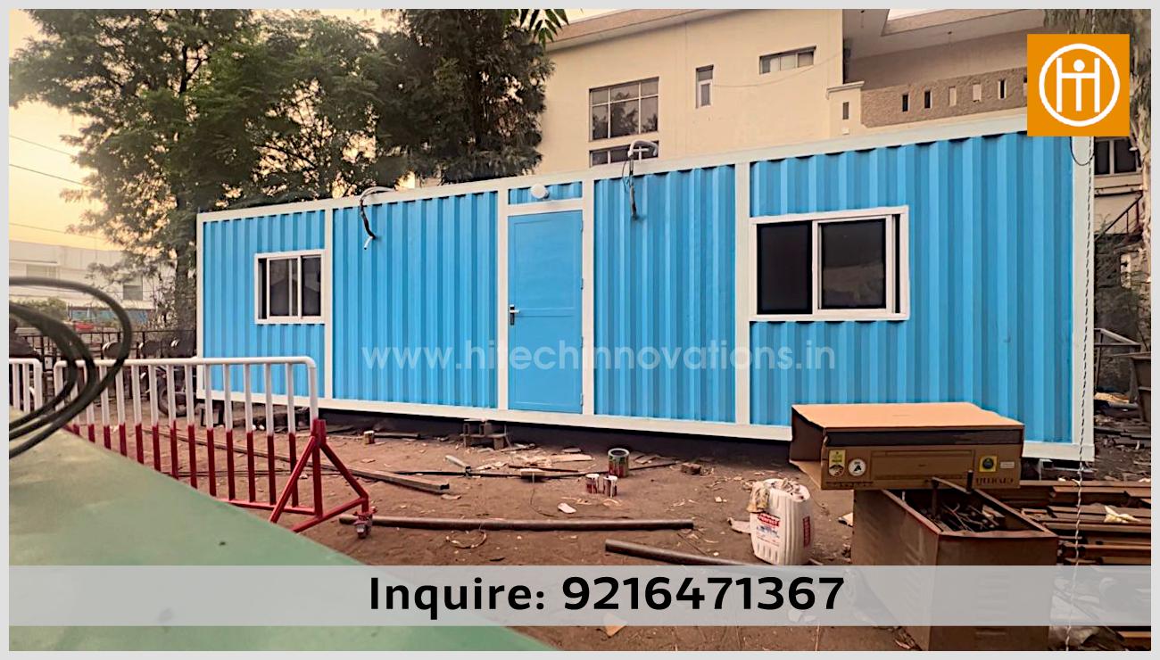 Completed blue container home by Hitech Innovations featuring sliding windows and a secure entry door, perfect for a modular farm house.