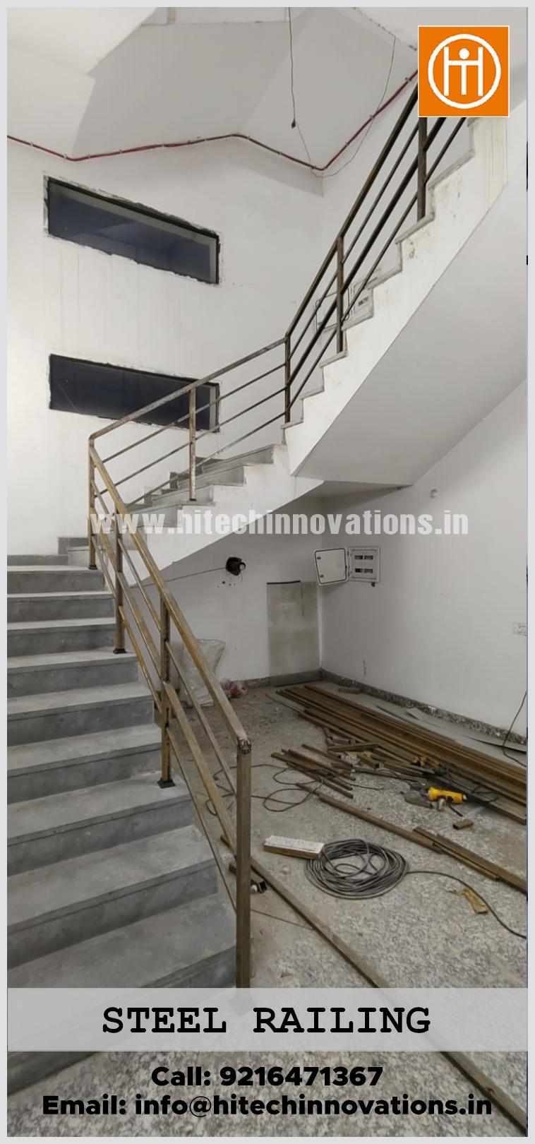 Side view of a heavy-duty stainless steel staircase railing for an industrial unit, custom-fabricated by Hitech Innovations