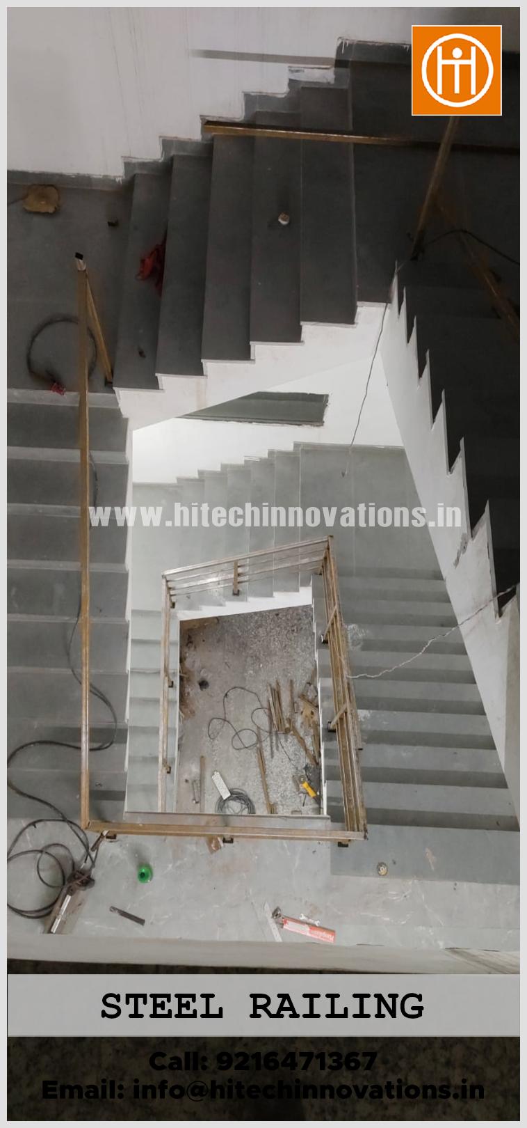 Top-down perspective of a square-profile stainless steel safety railing for an industrial building staircase, manufactured by Hitech Innovations