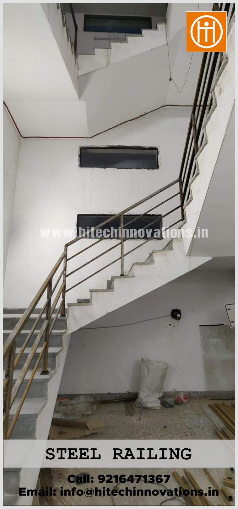 Industrial grade multi-tier stainless steel handrail installation on a concrete staircase by Hitech Innovations