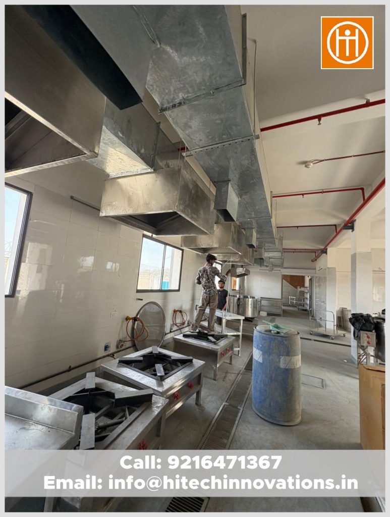 Industrial high-flame burners and stainless steel exhaust hoods installed in a commercial kitchen in Manali.
