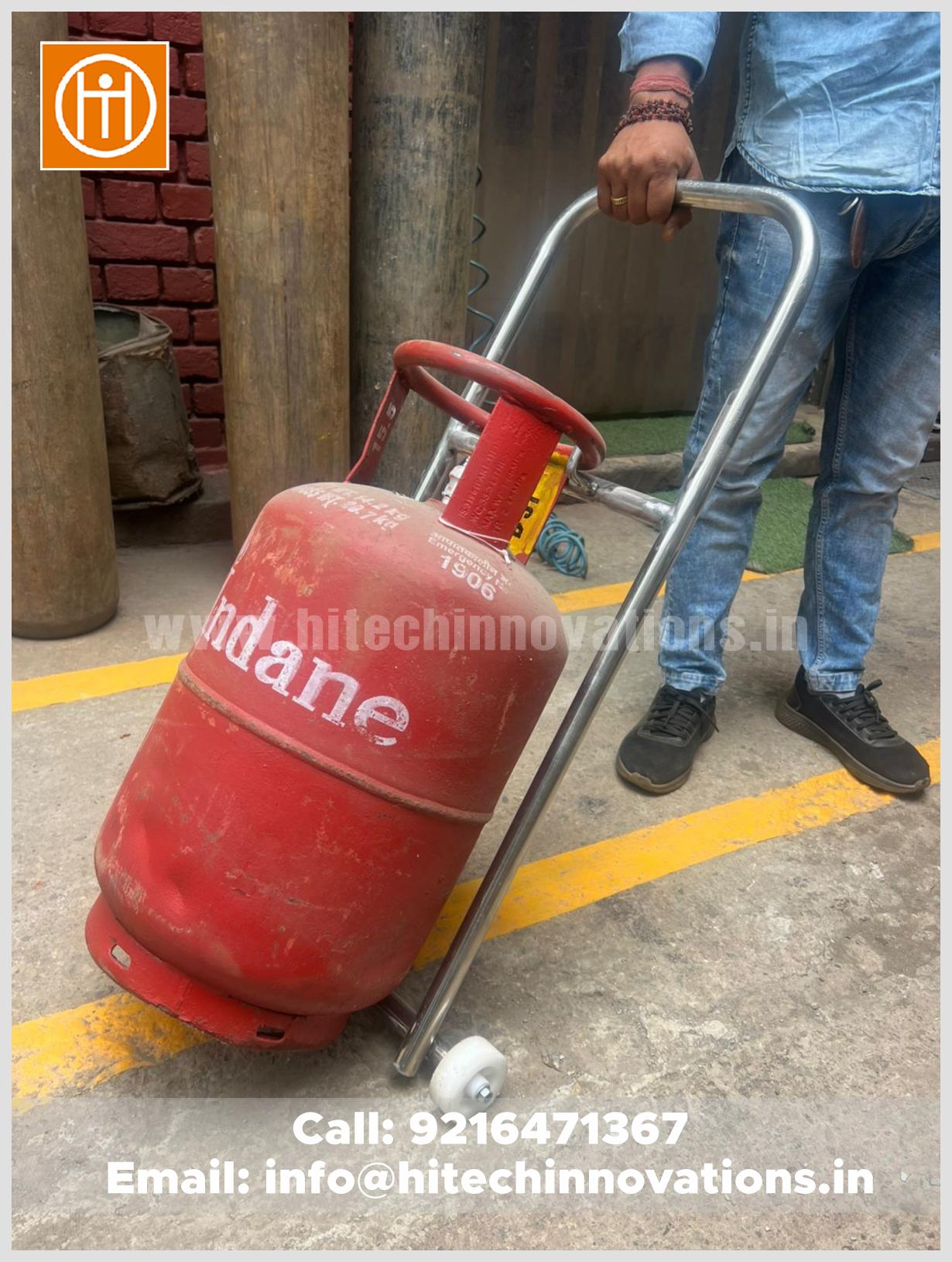 Portable gas cylinder trolley by Hitech Innovations Mohali being used to transport a 50kg LPG cylinder effortlessly.
