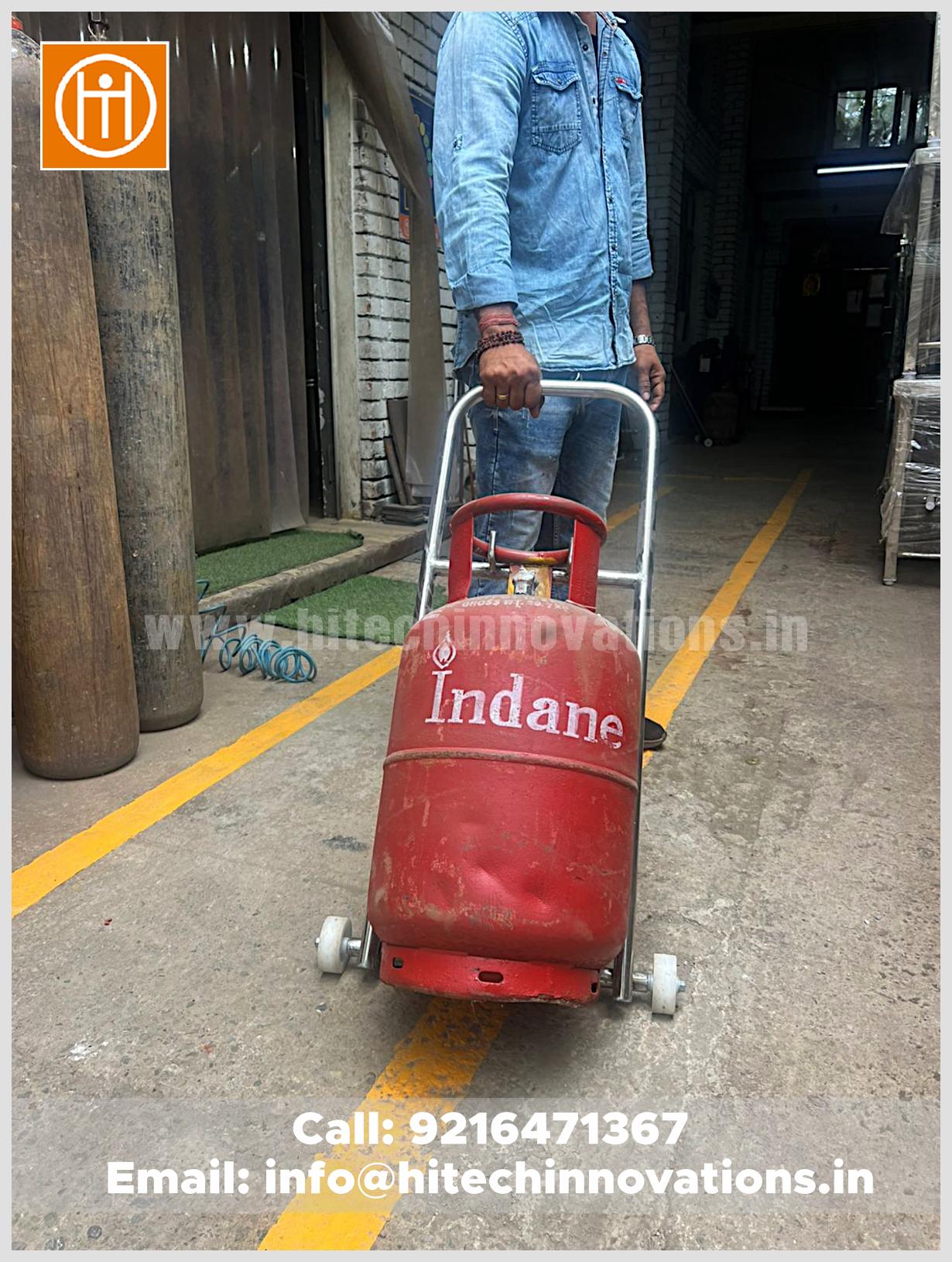 Front view of a rust-proof stainless steel gas cylinder trolley with sturdy white wheels for smooth indoor movement.