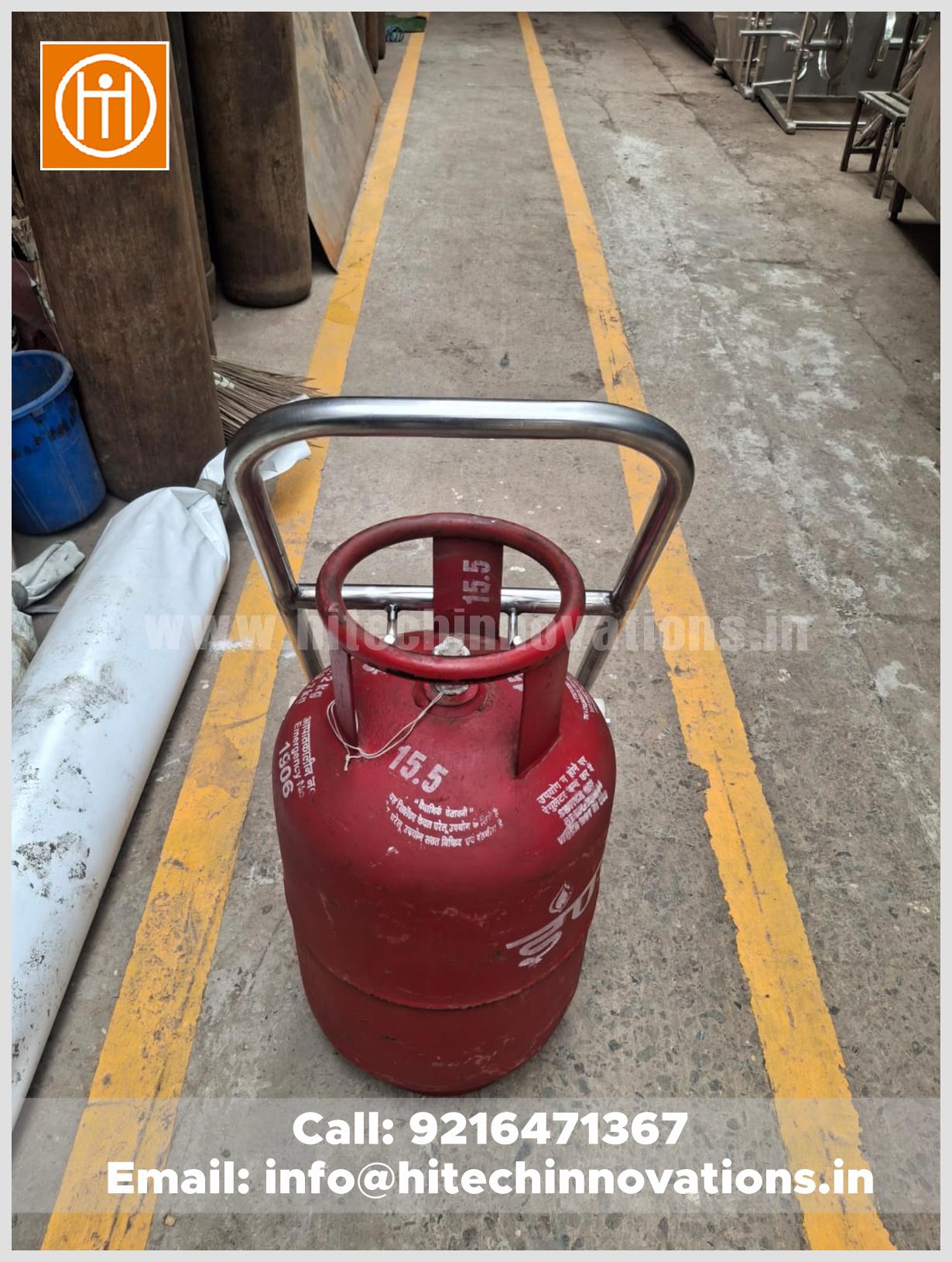 Stainless steel gas cylinder trolley positioned in a factory floor showing durability and high-precision fabrication.