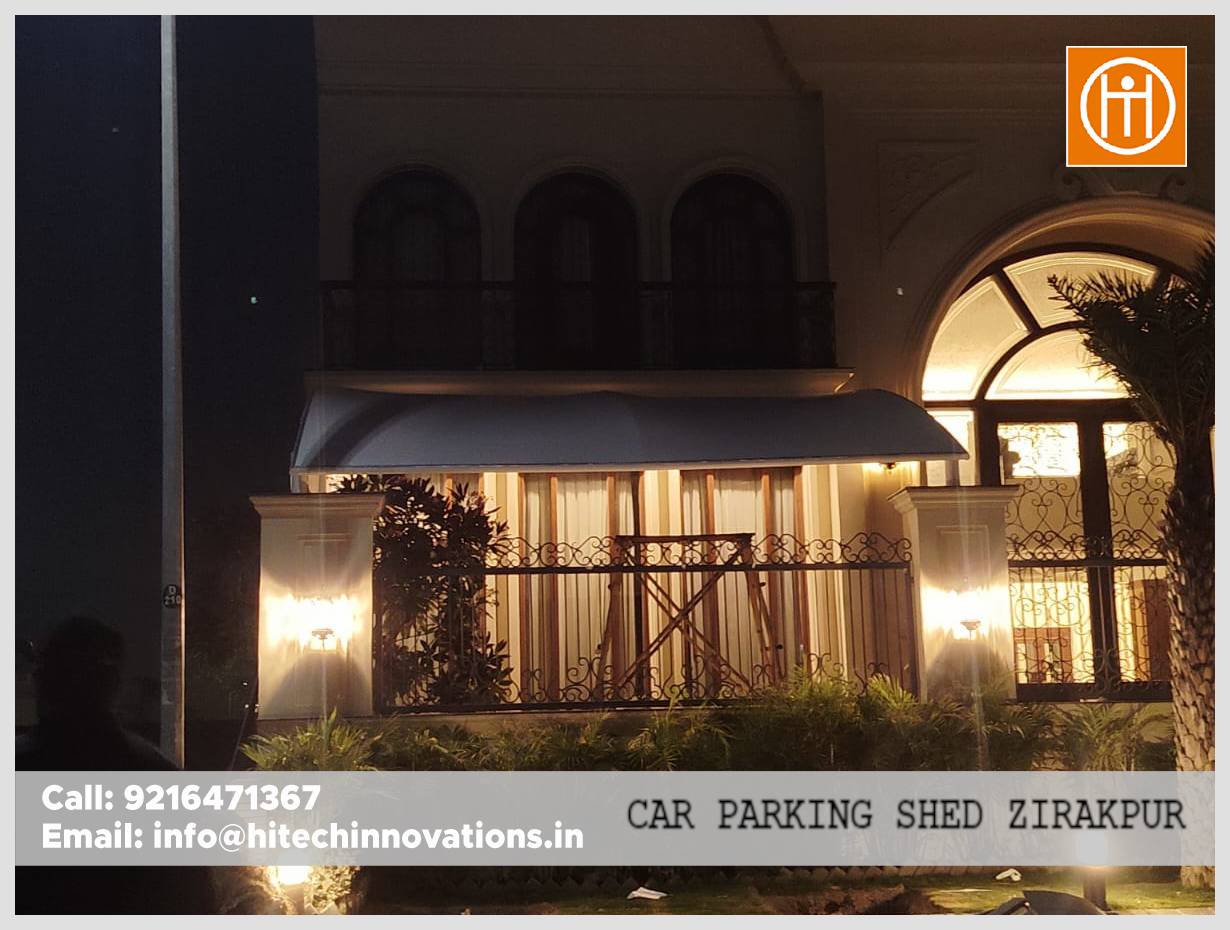 Front view of tensile car parking shed at Zirakpur residence by Hitech Innovations