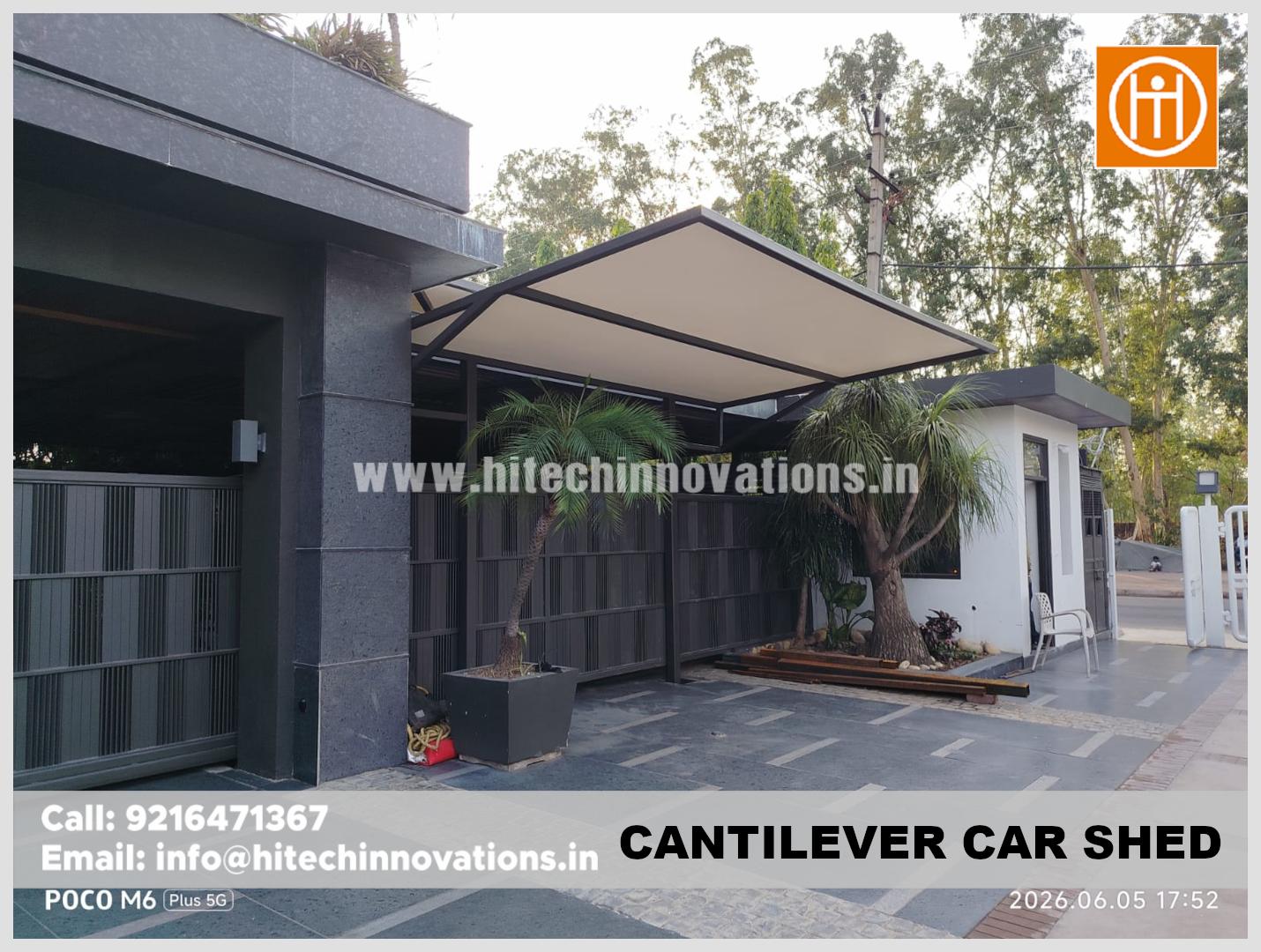 A modern, sleek cantilever car shed installed in a residential driveway in Patiala, built by Hitech Innovations.