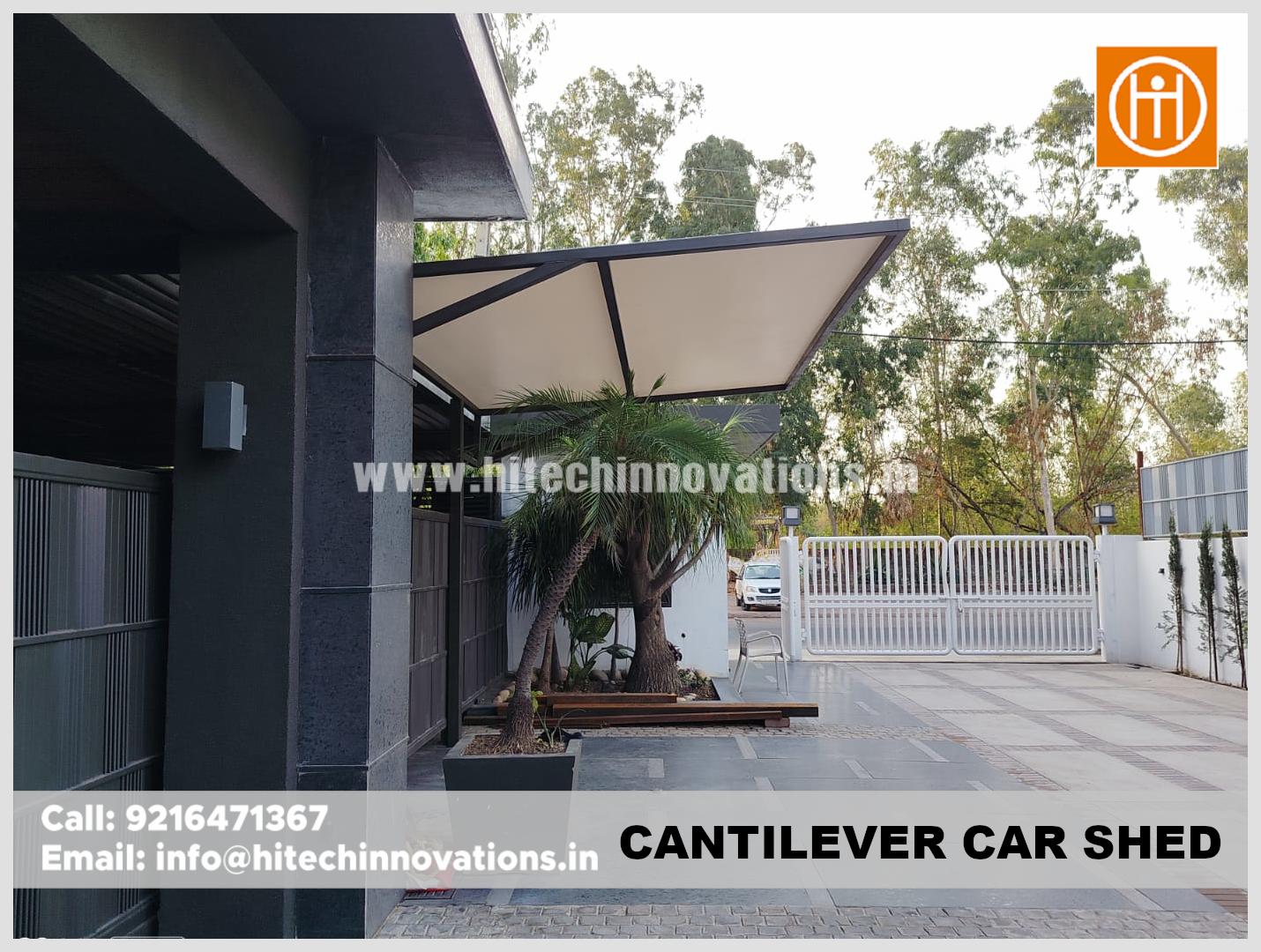 Exterior view of a high-end cantilever car shed providing shade for a residential parking area in Patiala.