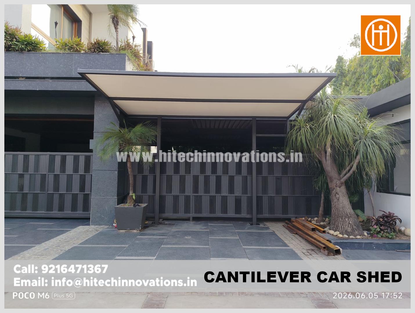 Front profile of a custom-built cantilever car shed with a minimalist aesthetic and high-durability construction.
