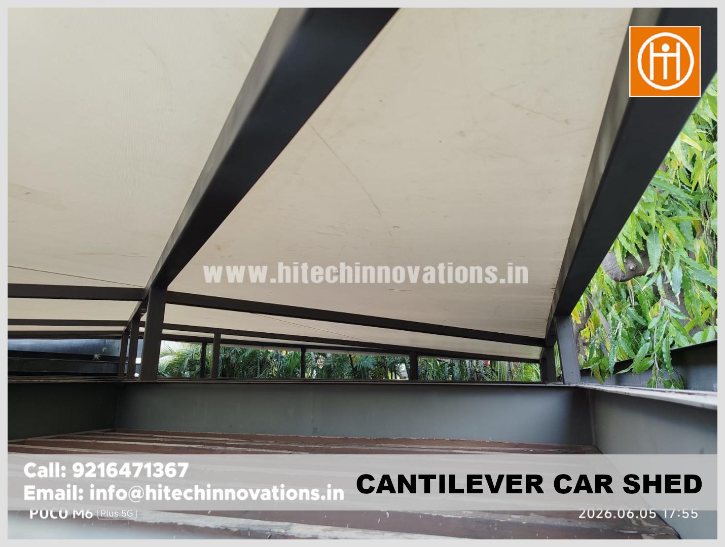 Underneath perspective of the steel framing and roof structure of a cantilever car shed by ISO 9001:2015 certified Hitech Innovations.