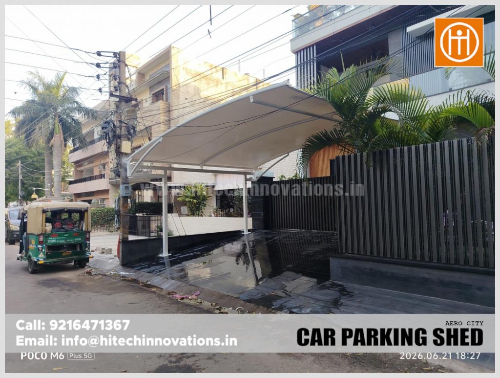 A sleek white tensile car parking shed installed at a modern residence in AERO City, Mohali.