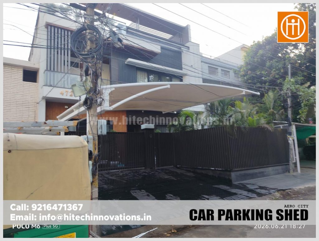 Angular view showing the sturdy design of the tensile car parking shed at a residential property.
