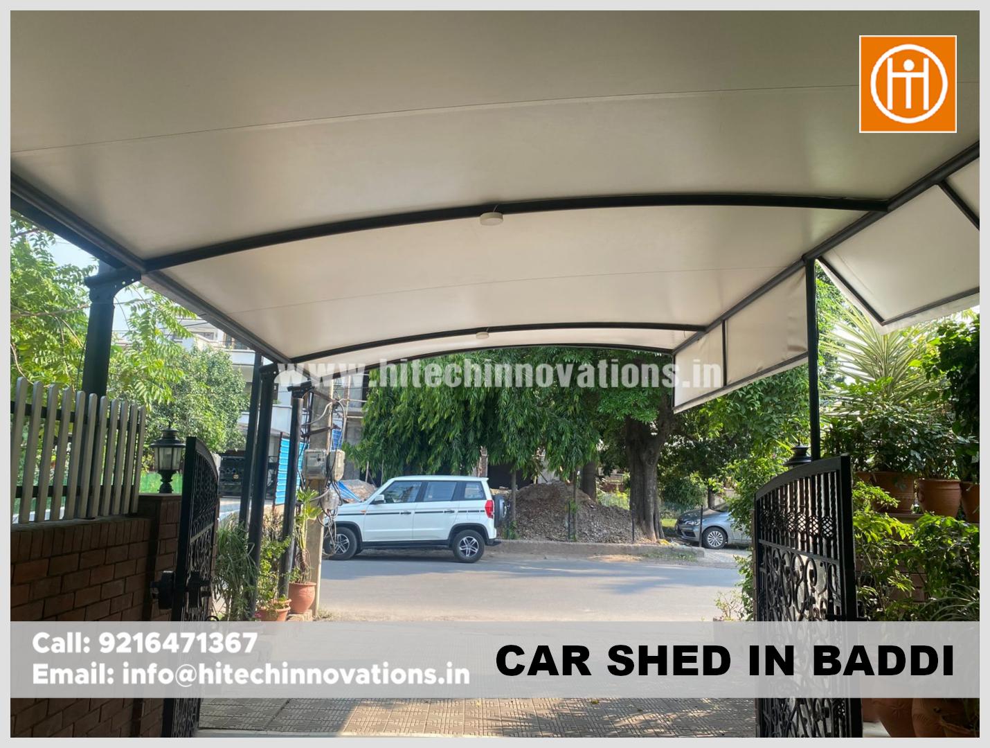Modern arched tensile fabric car parking shed installed at a residential property in Baddi by Hitech Innovations.
