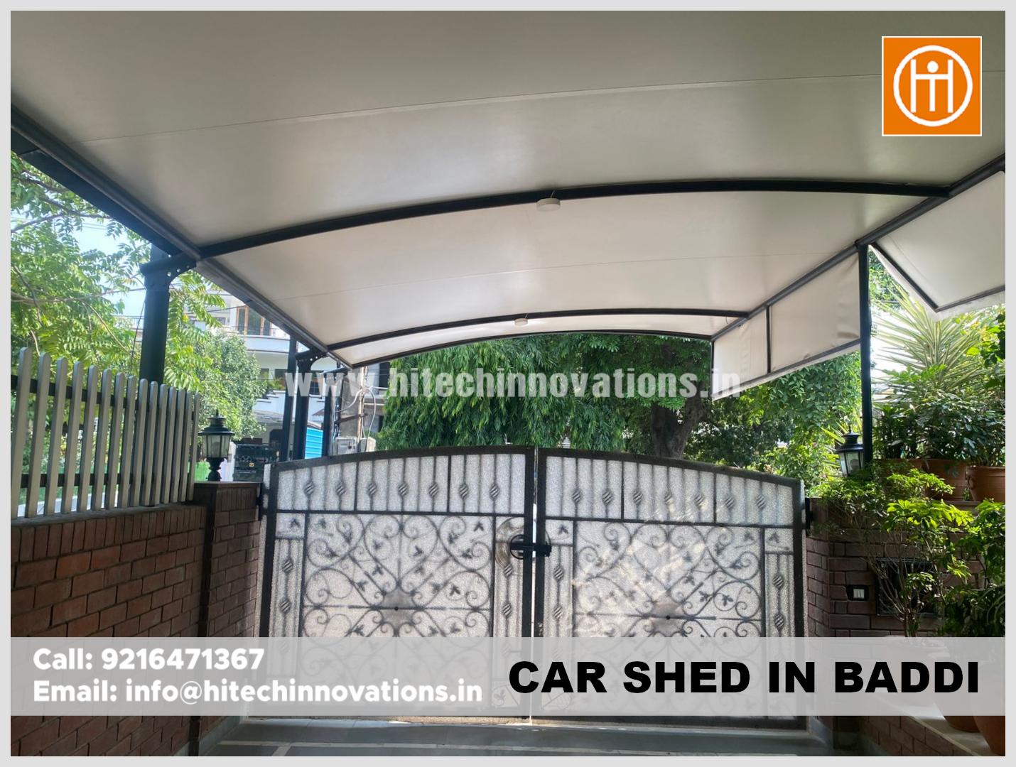 High-quality MS pipe and tensile fabric car shed structure, providing shade and style to a Baddi home driveway.