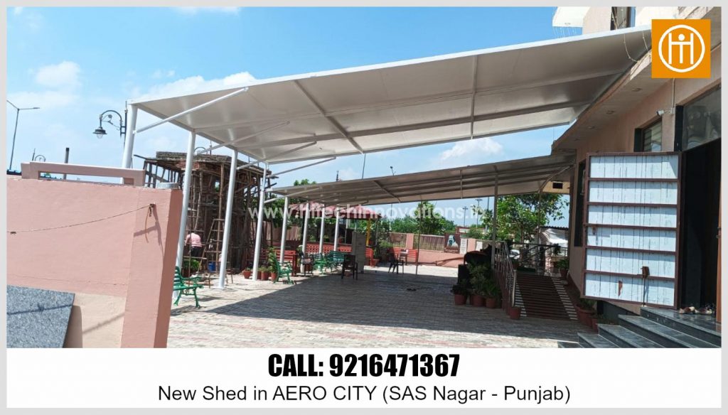 View of the newly installed outdoor shade structure by Hitech Innovations in Aero City, SAS Nagar, Punjab with paved courtyard and surrounding greenery