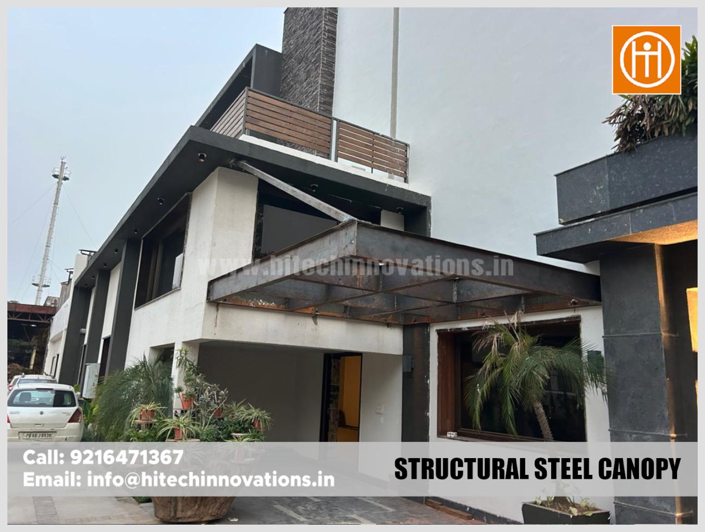 Side view of a newly installed structural steel canopy on a modern home facade.