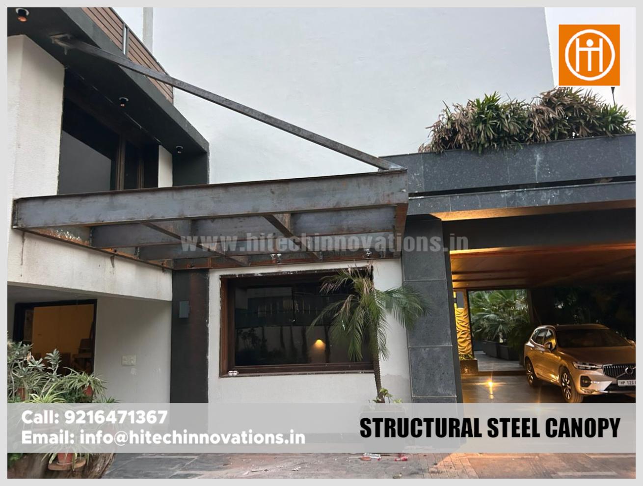 Angled view of a custom steel canopy frame integrated into a modern house design.