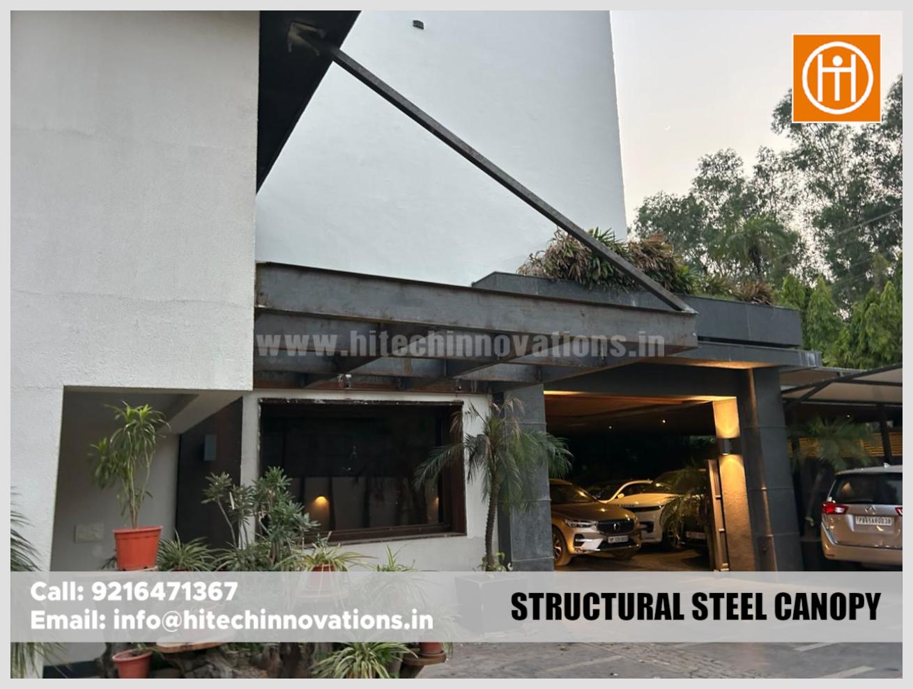 Completed structural steel canopy installation featuring a modern support beam design on a home exterior.