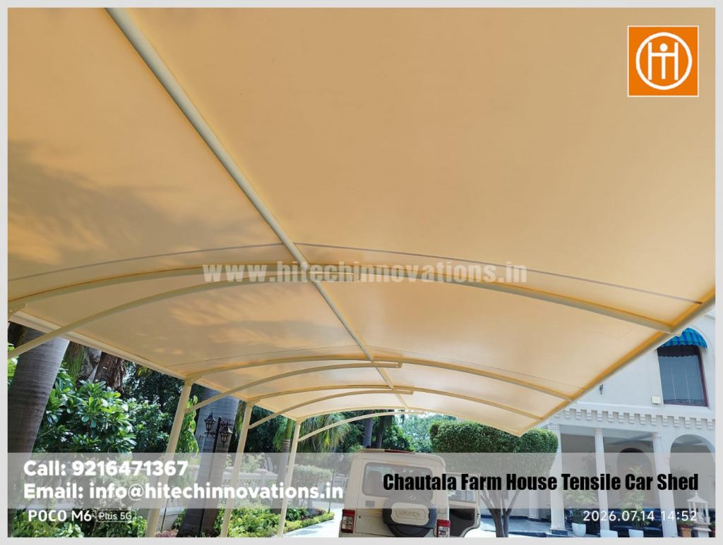 View looking up at the high-quality tensile fabric canopy of the car parking shed.