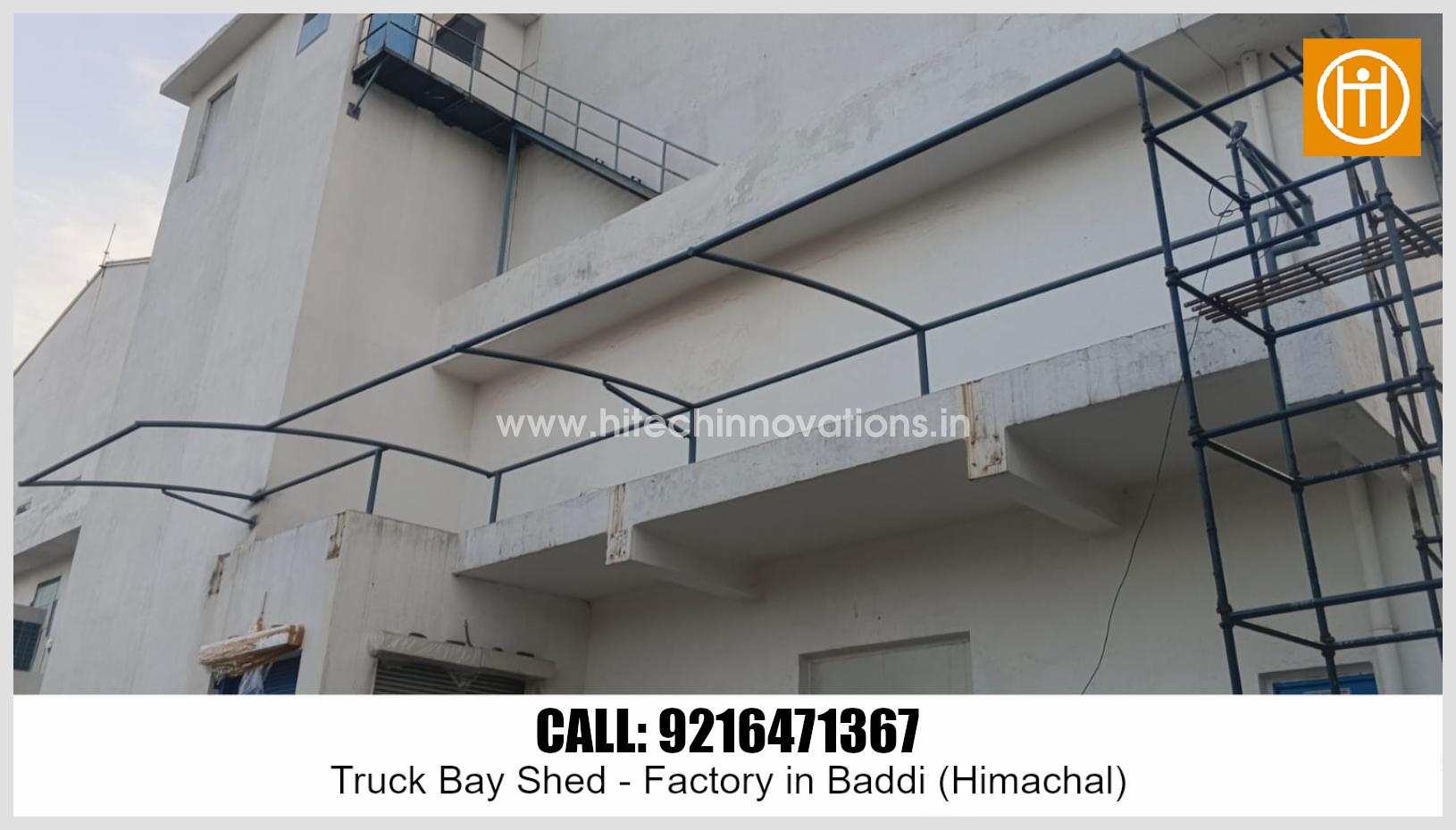 Close-up view of structural steel supports for the tensile truck bay shed at a manufacturing facility