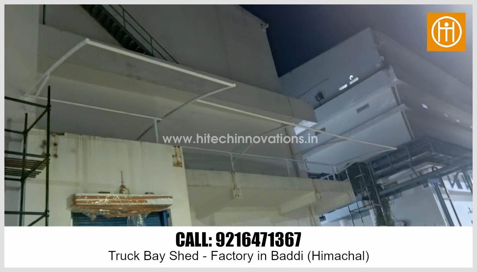 Evening view of the newly installed tensile structure framework at the factory loading dock