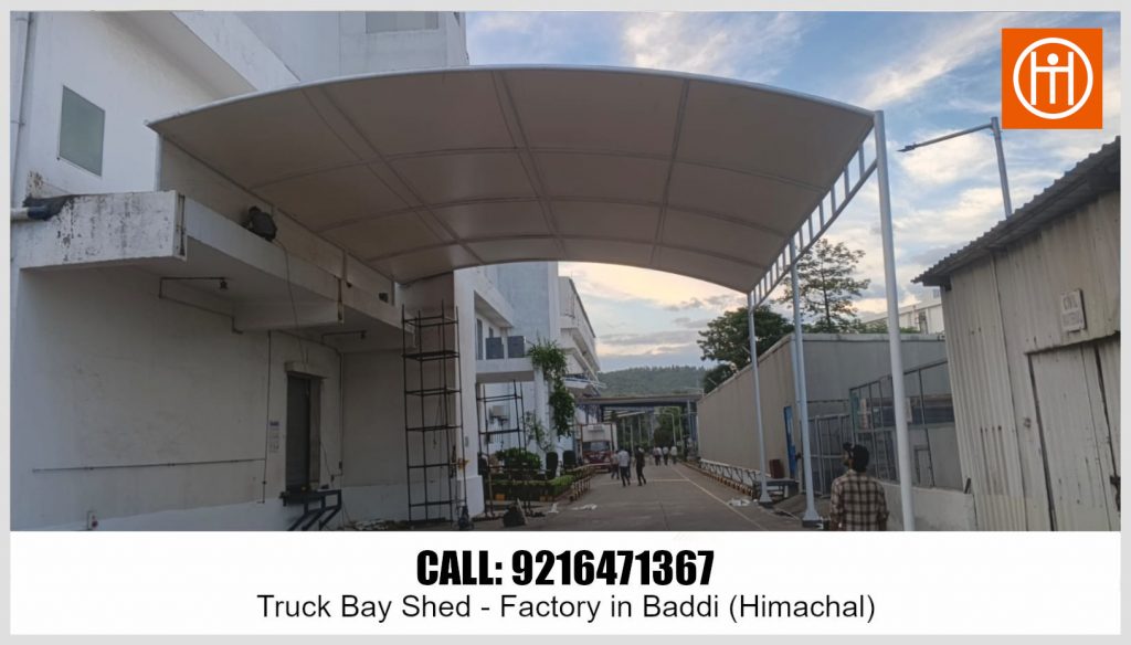 Front view of the finished tensile truck bay shed providing weather protection for the factory bay