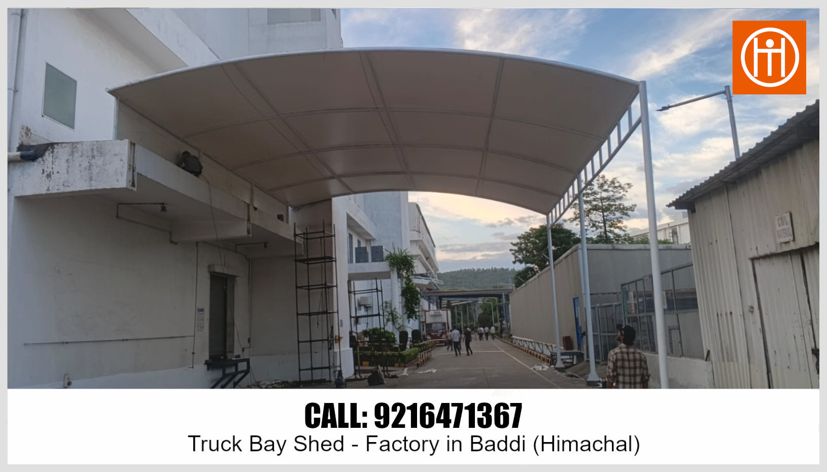 Front view of the finished tensile truck bay shed providing weather protection for the factory bay