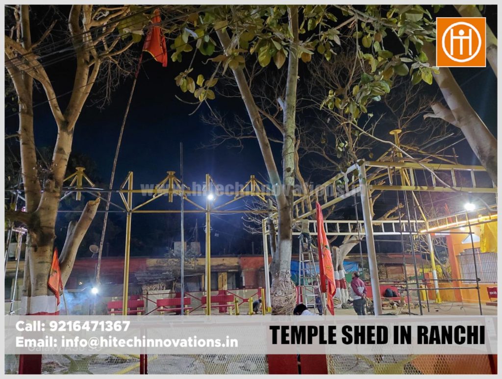 Workers assembling the steel columns for a temple shed project in Ranchi.