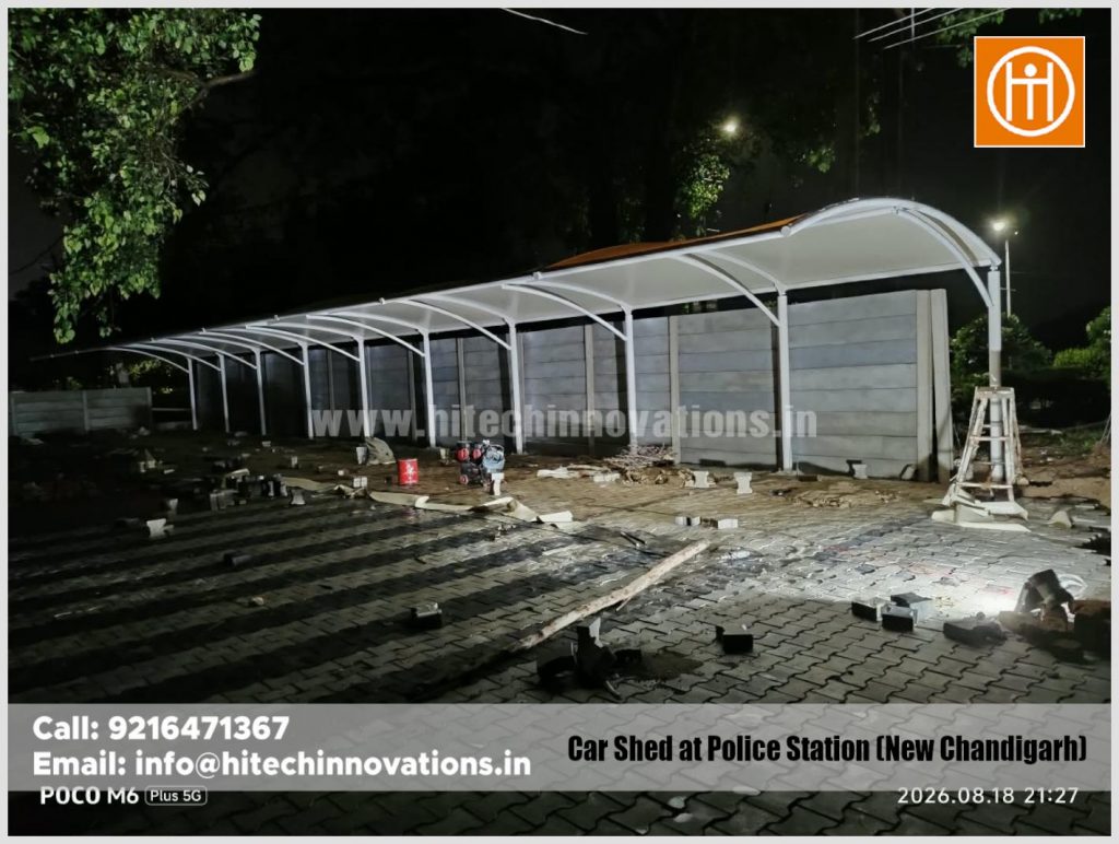 Completed 85x17 feet tensile vehicle parking shed illuminated at night at the Mullanpur New Police Post.