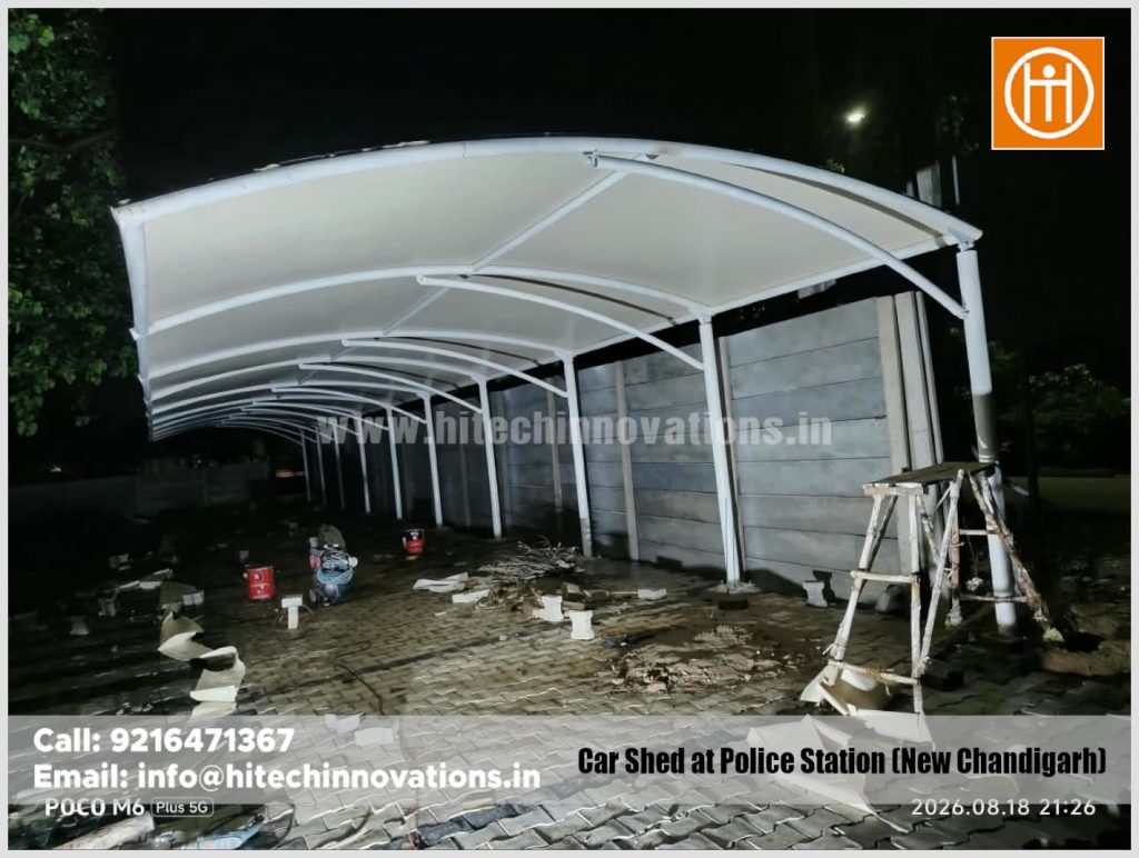Close-up exterior view of the finished low-maintenance tensile car parking shed structure in New Chandigarh.