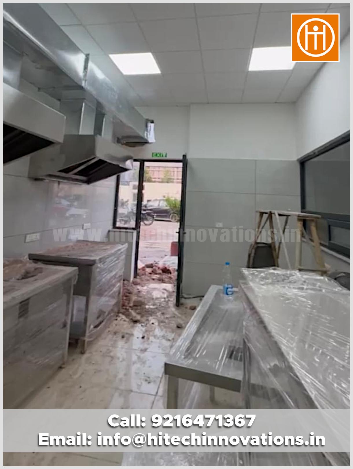 Newly installed stainless steel commercial kitchen equipment, working tables, and fume ducting systems delivered as a turnkey project by Hitech Innovations Mohali.