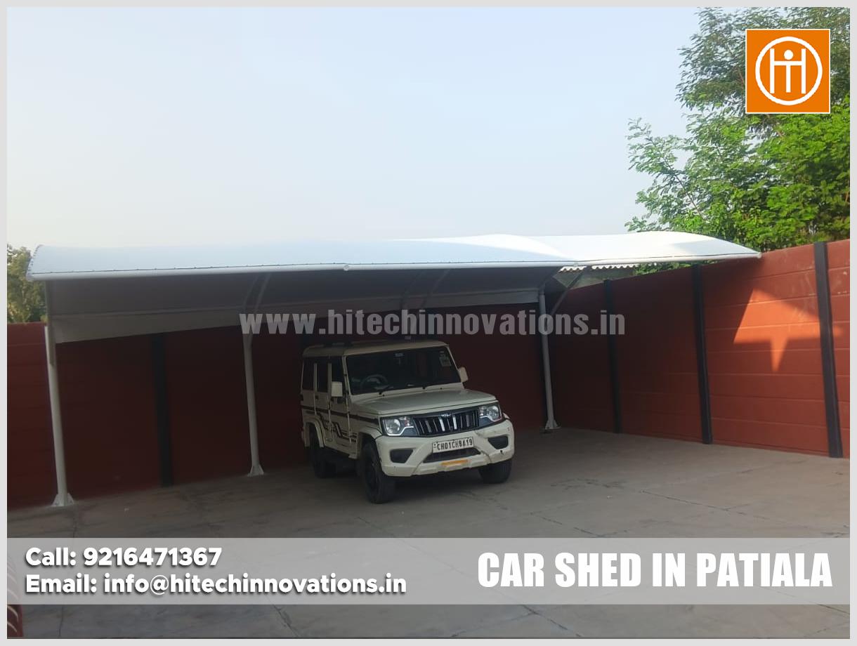 Under-canopy view of durable tensile car parking shed fabric and steel framework