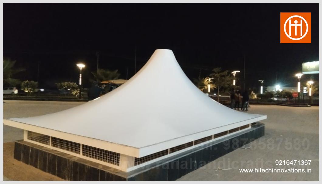 Night view of a tensile fabric canopy over a basement ventilation shaft with integrated mesh grilles in Aerocity Road Zirakpur