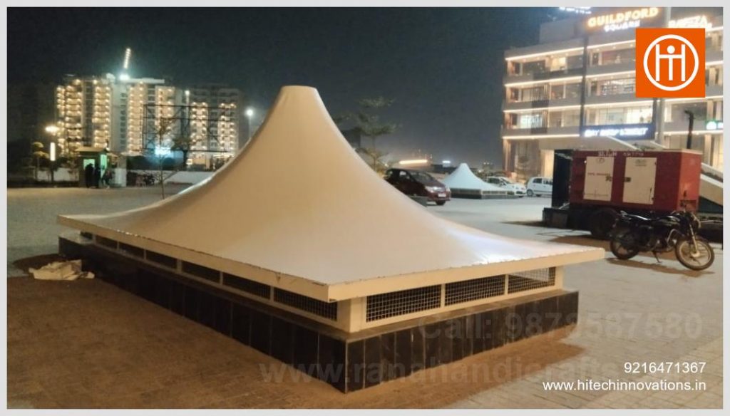 Exterior wide shot of conical tensile membrane shaft cover installed at commercial plaza on Aerocity Road Bir Chhat Zirakpur